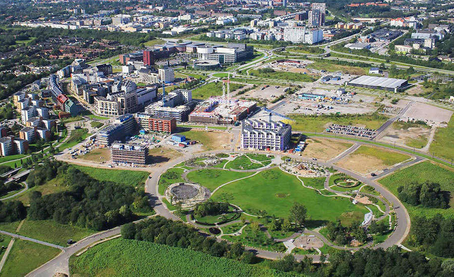 Aerial view of the city of Lund with green areas surrounding buildings.