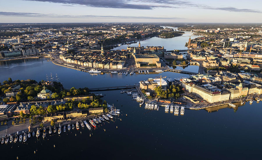 Aerial view of the city Stockholm with buildings, a port and water.